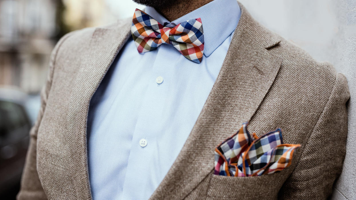 Close up of well dressed man's torso.