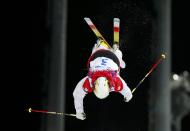 Canada's Chloe Dufour-Lapointe performs a jump during the women's freestyle skiing moguls final competition at the 2014 Sochi Winter Olympic Games in Rosa Khutor, February 8, 2014. REUTERS/Mike Blake (RUSSIA - Tags: SPORT OLYMPICS SPORT SKIING)