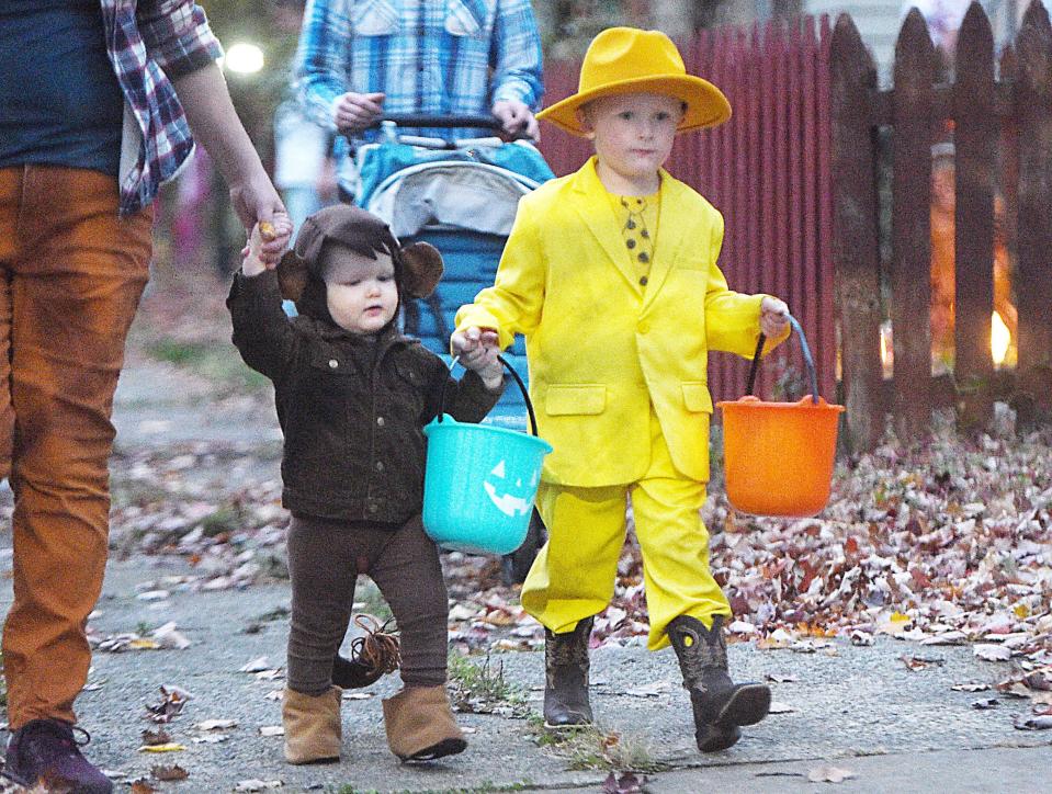 Lincoln Hrytzik and his brother Ethan Hrytzik trick-or-treat on West Ninth Street during Halloween in Erie on Oct. 31, 2022.