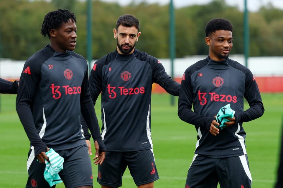 Manchester United’s Kobbie Mainoo, Bruno Fernandes and Amad Diallo at training (REUTERS)