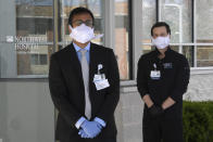 In this Thursday, April 2, 2020, photo Pothik Chatterjee, Executive Director of Innovation and Research at Lifebridge Health, left, and Dr. Daniel Durand, Chief Innovation Officer at Lifebridge Health, right, pose for a portrait in Randallstown, Md. (AP Photo/Susan Walsh)