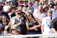 Fans attend a NASCAR Cup Series auto race on Sunday, Nov. 7, 2021, in Avondale, Ariz. (AP Photo/Rick Scuteri)