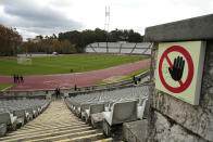 A Portuguese Under-23 league soccer match gets underway at the National stadium in Oeiras, outside Lisbon, Monday, Nov. 29, 2021. The stadium is the home ground of the Lisbon-based Belenenses SAD club which played there a Portuguese Primeira Liga match against Benfica Saturday starting with only nine players due to a coronavirus outbreak. Portuguese health authorities on Monday identified 13 cases of omicron, the new coronavirus variant spreading fast globally, among members of Belenenses SAD. (AP Photo/Armando Franca)