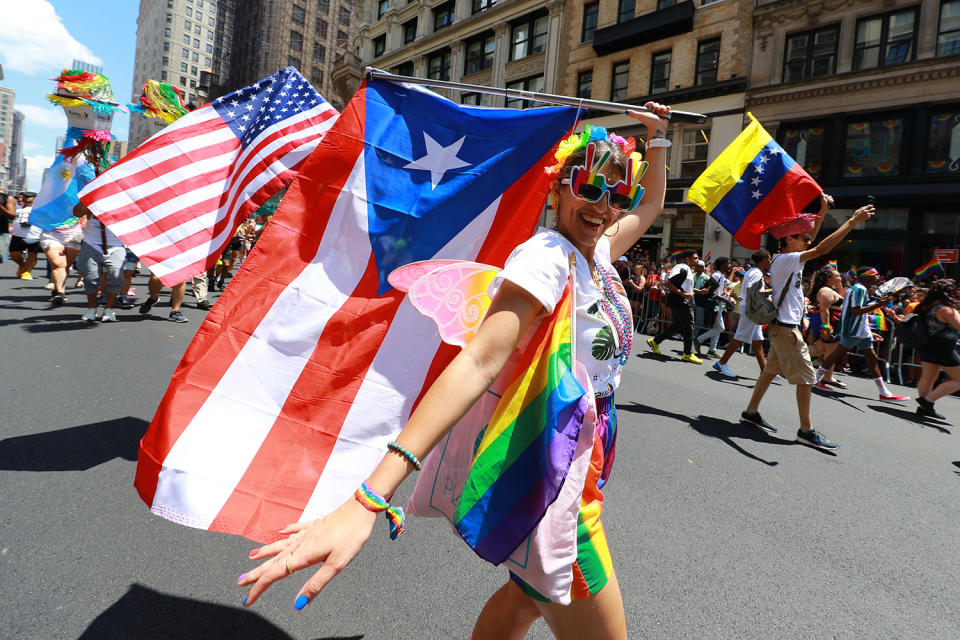 Marchers wave rainbow flags during the NYC Pride Parade in New York, Sunday, June 30, 2019. (Gordon Donovan/Yahoo News)