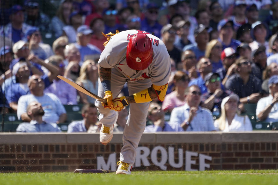 St. Louis Cardinals' Yadier Molina breaks his bat on the ground after flying out off a pitch from Chicago Cubs starting pitcher Javier Assad during the fourth inning of a baseball game Tuesday, Aug. 23, 2022, in Chicago. (AP Photo/Charles Rex Arbogast)