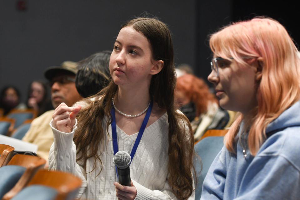 East Lansing High School senior Allison Treanor, left, speaks during a meeting Friday, Jan. 27, 2023, in response to violence at the school.