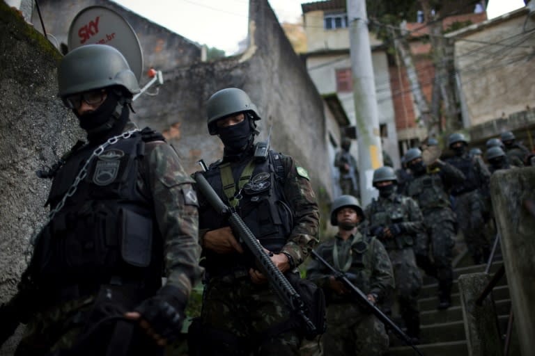 Members of Brazil's Armed Forces patrol inside the favelas of Rio de Janeiro, where they have been in charge of security since earlier this year