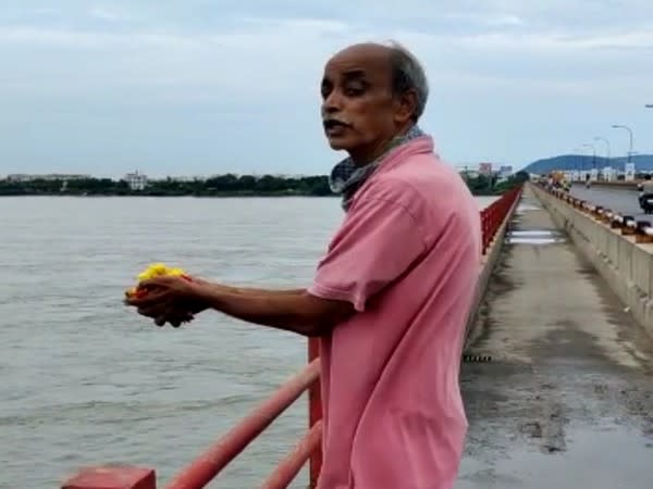 Manne Durga Prasad jumped into river Krishna at Tadepalli on Monday. [Photo/ANI]