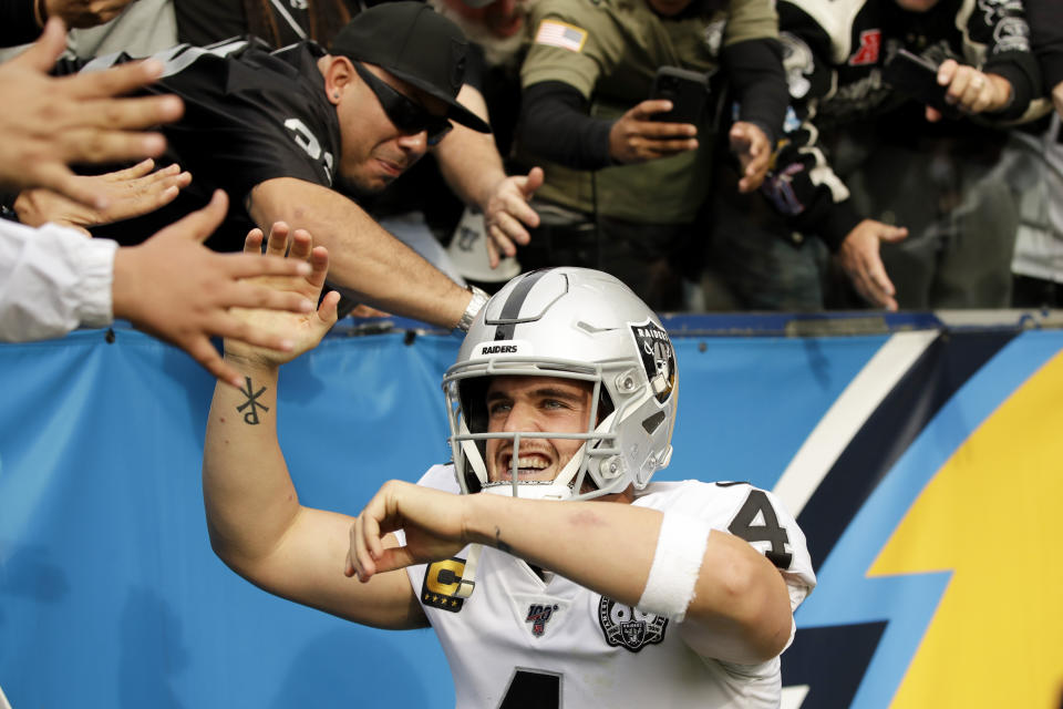 Oakland Raiders quarterback Derek Carr celebrates after scoring during the first half of an NFL football game against the Los Angeles Chargers Sunday, Dec. 22, 2019, in Carson, Calif. (AP Photo/Marcio Jose Sanchez)