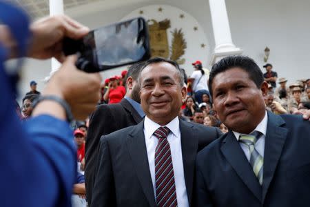 Justo Noguera Pietri (C), newly elected governor of Bolivar state, poses for a picture as he arrives for a ceremony at the National Constituent Assembly at Palacio Federal Legislativo, in Caracas, Venezuela October 18, 2017. REUTERS/Marco Bello