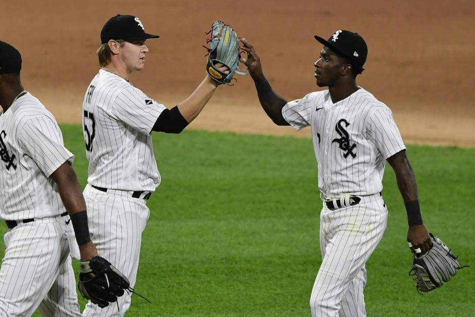 Chicago White Sox closing pitcher Jace Fry, left, celebrates with teammate Tim Anderson, right, after defeating the Detroit Tigers in a baseball game Tuesday, Aug. 18, 2020, in Chicago. (AP Photo/Paul Beaty)