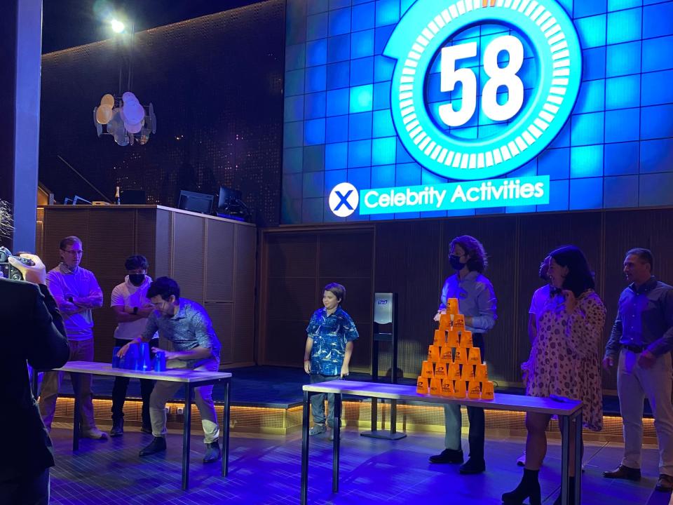 people playing a game show on a cruise ship