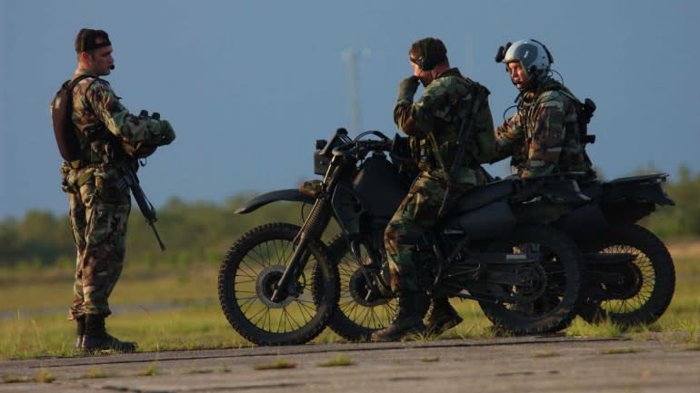 A pair of USAFSOC Forward Air Controllers aboard KLR250-D8s/