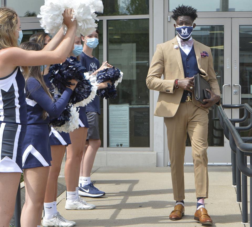 McDowell High School cheerleaders greet newly appointed Millcreek Township School District Superintendent Ian Roberts after his swearing-in ceremony at the Erie County Courthouse on Aug. 12. 2020.