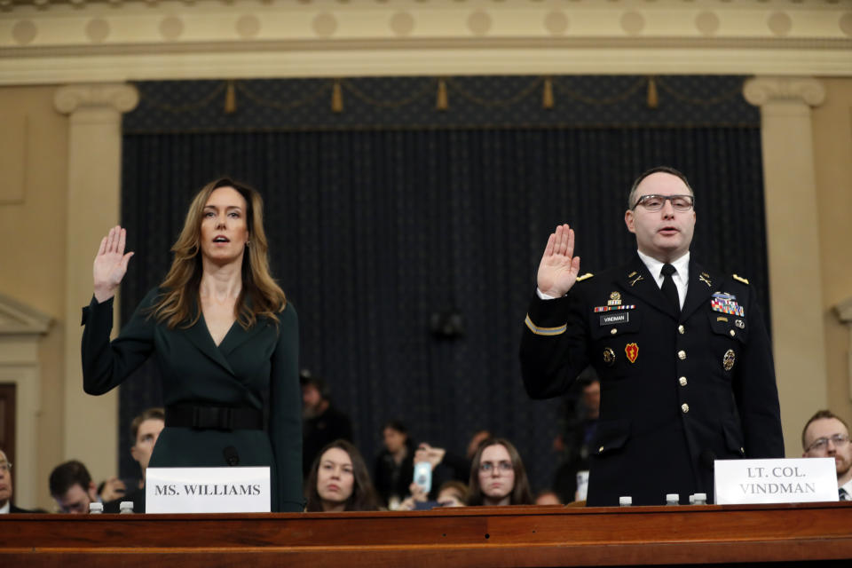 Jennifer Williams, an aide to Vice President Mike Pence, left, and National Security Council aide Lt. Col. Alexander Vindman, are sworn in to testify before the House Intelligence Committee on Capitol Hill in Washington, Tuesday, Nov. 19, 2019. (Photo: Andrew Harnik/AP)