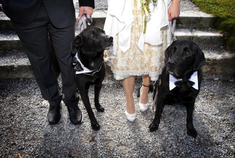 She decided to spend some time with her dog before the ceremony. [Photo: Getty]