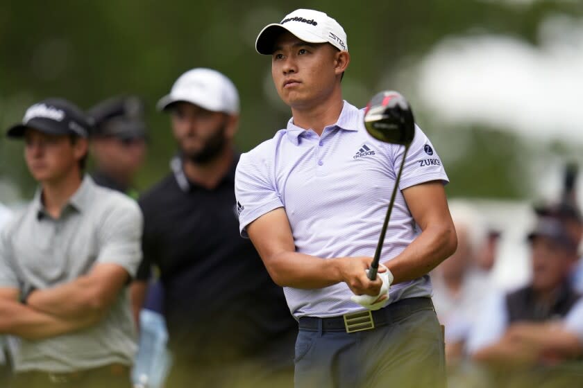 Collin Morikawa watches his shot on the 15th hole during the first round of the U.S. Open golf.