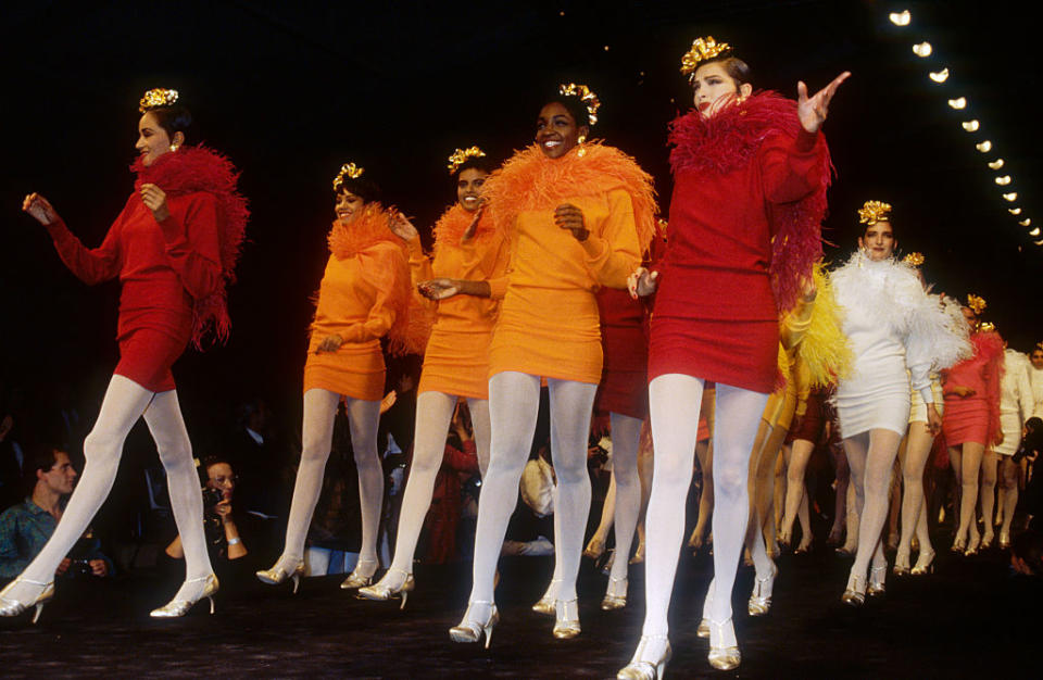 Japanese designer Kenzo Takada shows his women's 1991 spring-summer ready-to-wear line in Paris. The models are wearing short, colorful dresses with matching feather boas. (Photo by Pierre Vauthey/Sygma/Sygma via Getty Images)