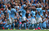 Manchester City's Raheem Sterling celebrates scoring with Manchester City's Yaya Toure during the Barclays Premier League match at the Etihad Stadium, Manchester.