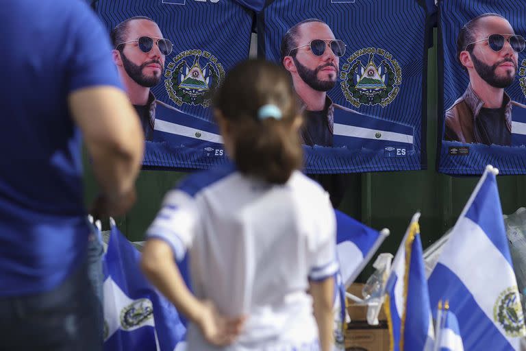 T-shirts with the image of El Salvador's President Nayib Bukele are for sale prior to the Independence Day military parade in San Salvador, El Salvador, Thursday, Sept. 15, 2022. Bukele announced on Independence Day that he will seek re-election to a second five-year term, one year after the new justices of the Constitutional Chamber of the Supreme Court appointed by his legislative allies ordered the Supreme Electoral Court to allow consecutive re-election, despite the country's constitutional ban. (AP Photo/Salvador Melendez