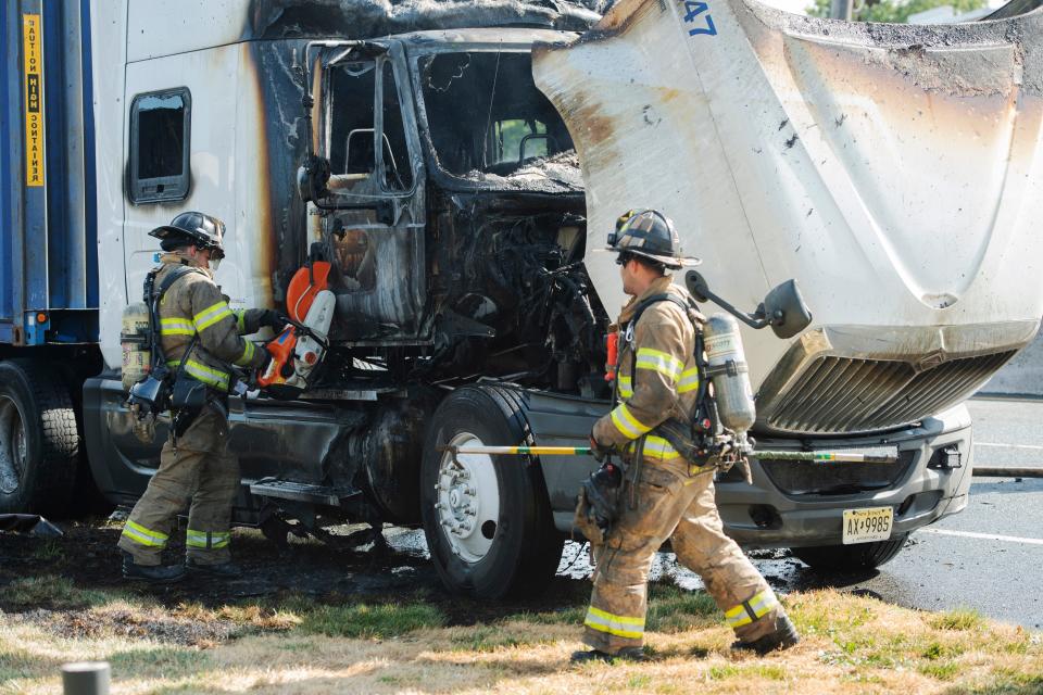 A fire in the cab of a tractor trailer shut down traffic on Route 17 southbound near Rochelle Park, N.J. on Monday morning Aug. 15, 2022. Rochelle Park firefighters work to put out the fire.