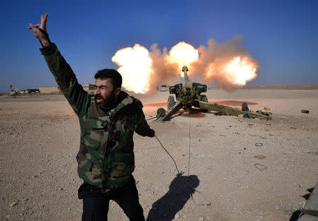 Popular Mobilization Forces (PMF) fires towards Islamic State militants during a battle with Islamic State militants, west of Mosul,Iraq February 22, 2017. REUTERS/Stringer