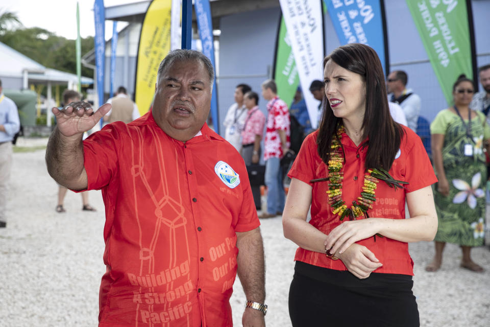 Nauru President Baron Waqa, left, talks with New Zealand Prime Minister Jacinda Ardern before the Pacific leaders gather for a photo opportunity during the Pacific Islands Forum in Nauru, Wednesday, Sept. 5, 2018. (Jason Oxenham/Pool Photo via AP)