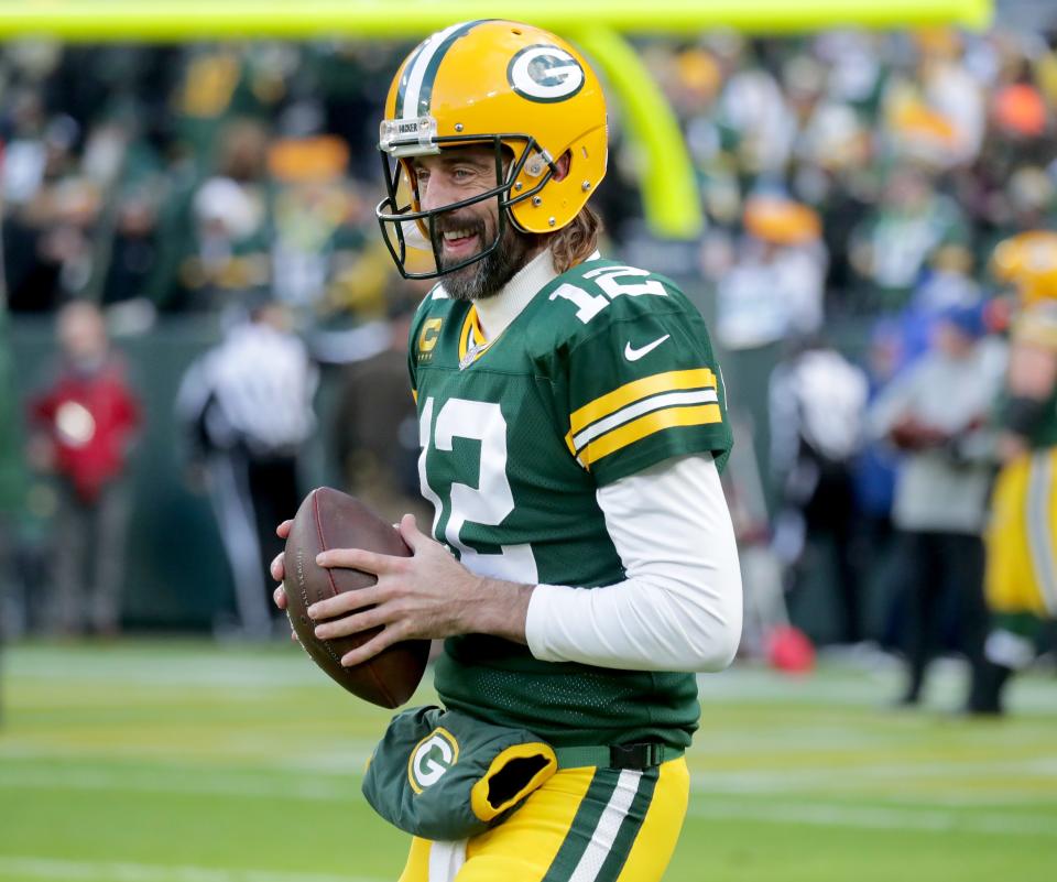 Green Bay Packers quarterback Aaron Rodgers (12) warms up before the game against the Los Angeles Rams at Lambeau Field in Green Bay on Sunday, Nov. 28, 2021.