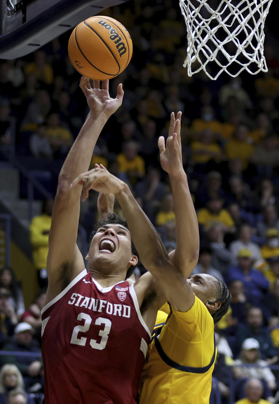 Stanford forward Brandon Angel (23) shoots against California forward Grant Newell, right, during the second half of an NCAA college basketball game in Berkeley, Calif., Friday, Jan. 26, 2024. (AP Photo/Jed Jacobsohn)