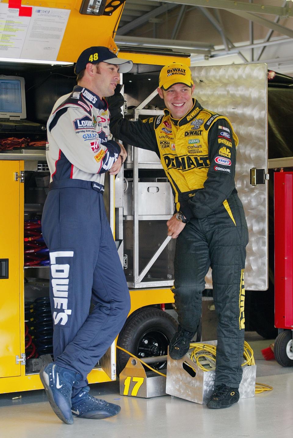 Kenseth  chats with Jimmie Johnson  in the garage at the Kansas Speedway in 2003. Neither had won a championship at that point, but Kenseth won that season and Johnson would win the first of his seven three years later.