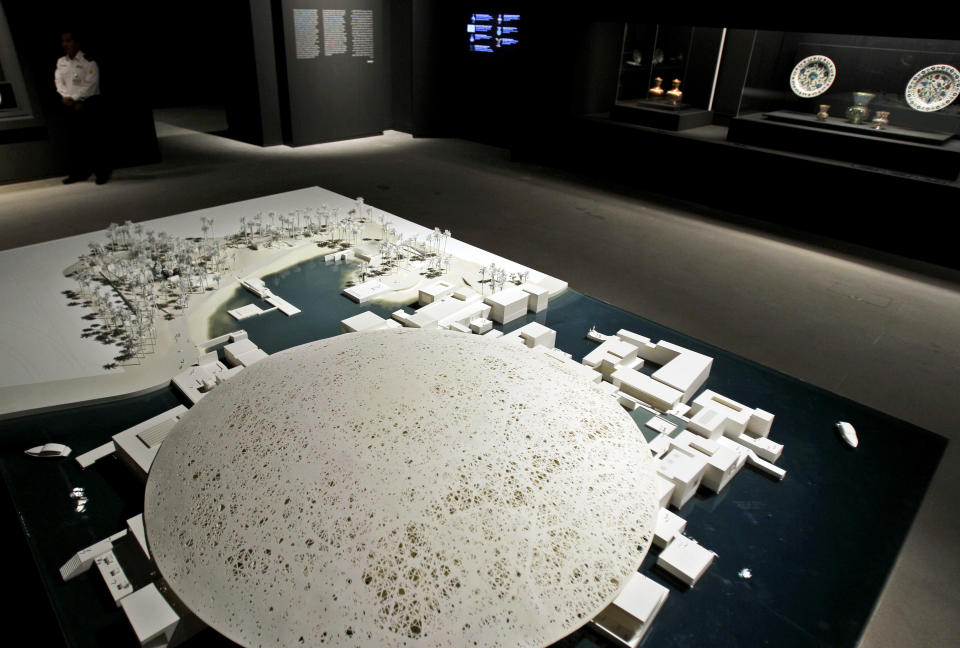 A model of the future Abu Dhabi branch of the Louvre museum by French architect Jean Nouvel is on display as part of a sample collection at the museum in Abu Dhabi, United Arab Emirates, Tuesday, April 16, 2013. No artistic subjects will be off limits at the Abu Dhabi branch of the Louvre museum as it builds its collection for a planned 2015 opening, a top overseer said Tuesday, in a city seeking to broaden its international profile but testing how far to open its conservative culture. (AP Photo/Kamran Jebreili)