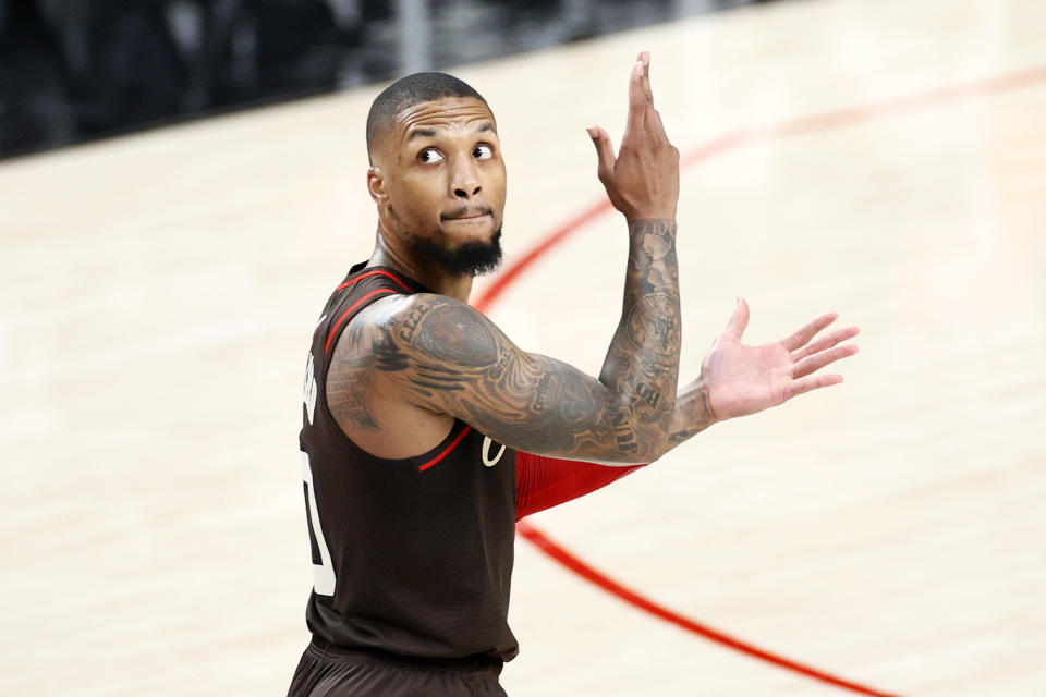 PORTLAND, OREGON - JUNE 03: Damian Lillard #0 of the Portland Trail Blazers reacts after his three point basket in the second quarter against the Denver Nuggets during Round 1, Game 6 of the 2021 NBA Playoffs at Moda Center on June 03, 2021 in Portland, Oregon. NOTE TO USER: User expressly acknowledges and agrees that, by downloading and or using this photograph, User is consenting to the terms and conditions of the Getty Images License Agreement. (Photo by Steph Chambers/Getty Images)