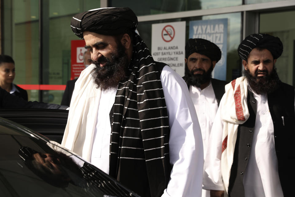 The Taliban delegation led by Amir Khan Muttaqi, the acting foreign minister, front, at Esenboga Airport, arrive in Ankara, Turkey, Thursday, Oct. 14, 2021. A high-level delegation of Afghanistan's new Taliban rulers has arrived in Turkey for talks with Turkish officials, the Foreign Ministry announced Thursday. The meetings in the capital of Ankara would be first between the Taliban and senior Turkish government officials after the group seized control of Afghanistan. (AP Photo/Burhan Ozbilici)