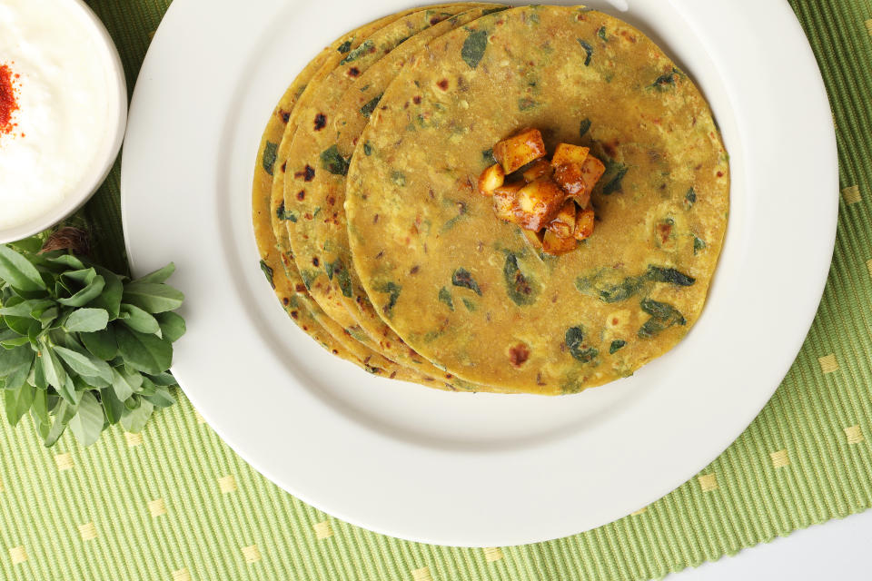 Methi Paratha (Thepla) / Indian flat bread using fenugreek leaves, served with mint dip,yogurt.