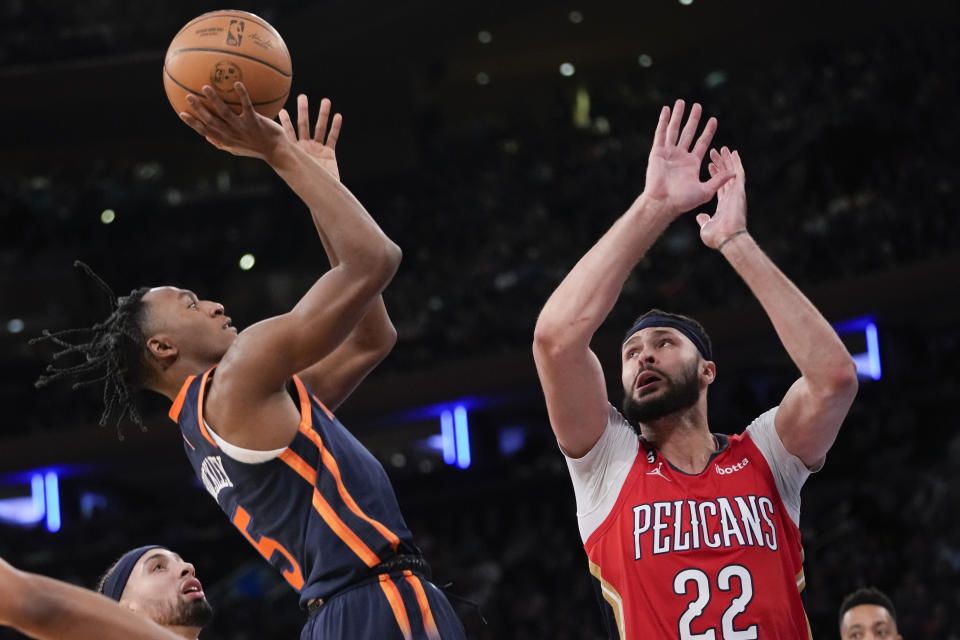 New York Knicks guard Immanuel Quickley (5) goes to the basket against New Orleans Pelicans forward Larry Nance Jr. (22) during the first half of an NBA basketball game Saturday, Feb. 25, 2023, at Madison Square Garden in New York. (AP Photo/Mary Altaffer)