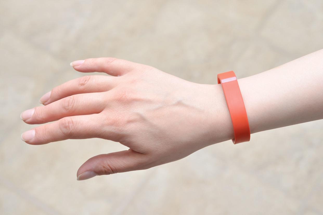 woman wearing a Fitbit Flex