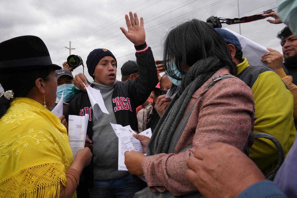 People with family and friends held inside Latacunga jail demand they be removed from the facility after a deadly riot in Latacunga, Ecuador, Tuesday, Oct. 4, 2022. A clash between inmates armed with guns and knives inside the prison has left at least 15 people dead and 20 injured. (AP Photo/Dolores Ochoa)