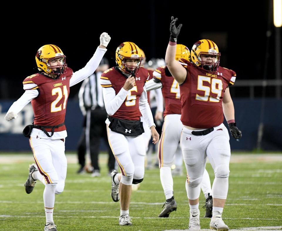 The New Bremen Cardinals celebrate during their game vs. Warren JFK in the OHSAA Division VII state finals at Tom Benson Hall of Fame Stadium. Saturday, Dec. 3, 2022.