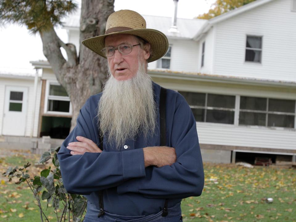 Samuel Mullet Sr. stands in front of his home in Bergholz, Ohio. The leader of a breakaway group accused in hair- and beard-cutting attacks on fellow Amish in 2011, Samuel Mullet Sr., currently in federal prison in Elkton, Ohio, and two of the 15 followers sentenced in the case have asked for a U.S. Supreme Court review, in a petition filed in September 2016.