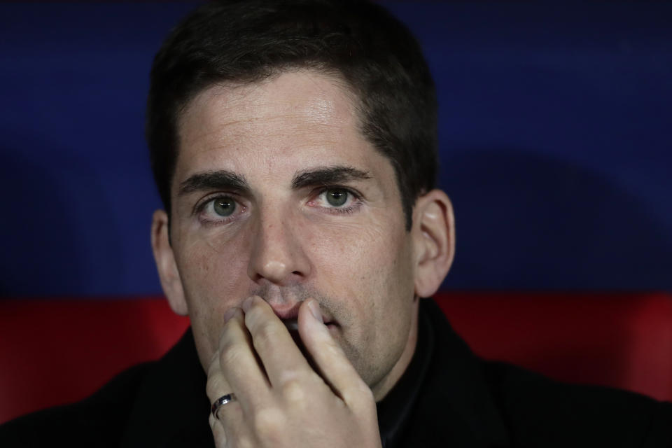 Spain head coach Robert Moreno sits on the bench during the Euro 2020 group F qualifying soccer match between Spain and Romania at the Metropolitano stadium in Madrid, Monday, Nov. 18, 2019. (AP Photo/Manu Fernandez)