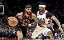 Toronto Raptors guard Gary Trent Jr., left, drives to the basket against Portland Trail Blazers guard Gary Payton II during the first half of an NBA basketball game in Portland, Ore., Saturday, Jan. 28, 2023. (AP Photo/Steve Dykes)