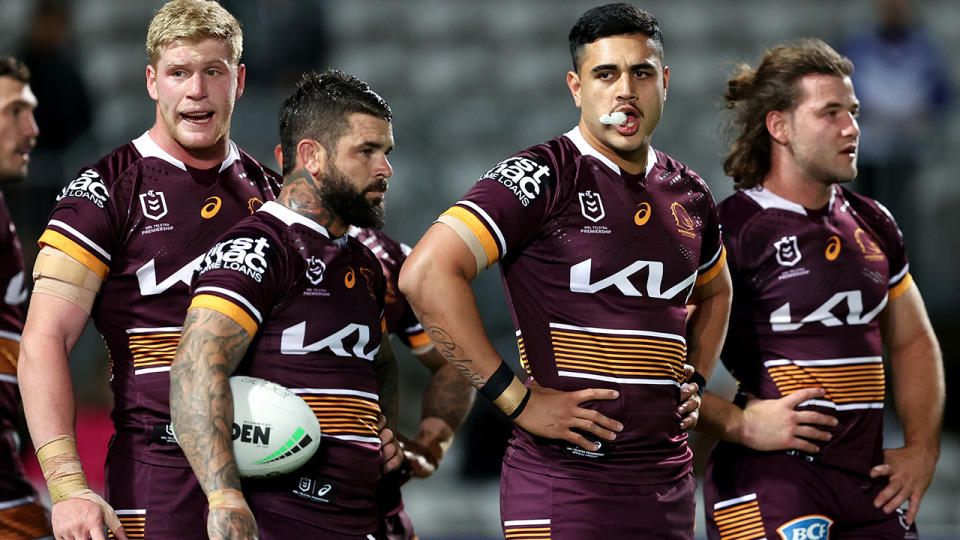 The Brisbane Broncos look dejected during their NRL loss to the St George Illawarra Dragons.