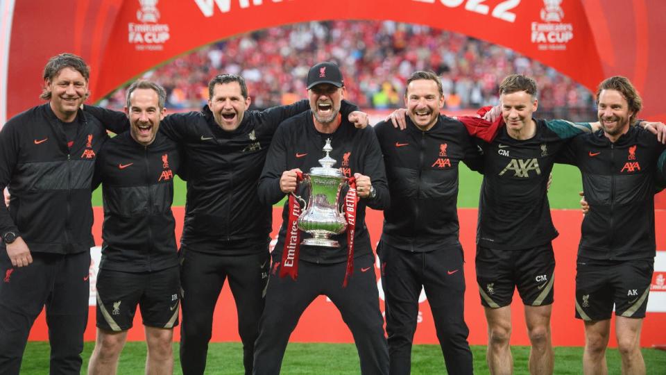 Liverpool boss Jurgen Klopp poses with all his staff Credit: PA Images