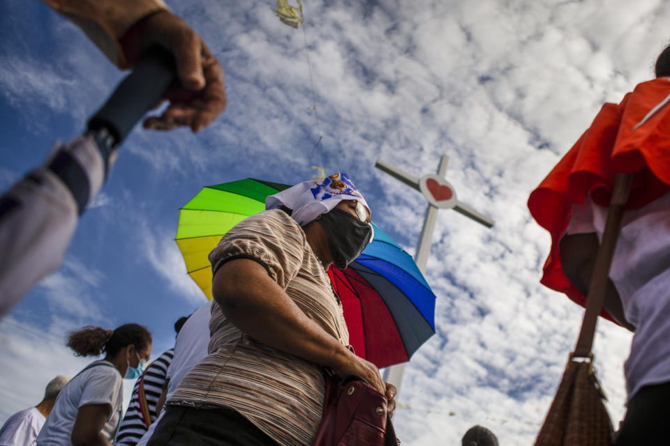 Faithful take part in a procession to the Cathedral in Managua, Nicaragua, Saturday, Aug. 13, 2022. The Catholic Church has called on the faithful to peacefully arrive at the Cathedral in Managua Saturday after National Police denied permission for a planned religious procession on “internal security” grounds. (AP Photo)