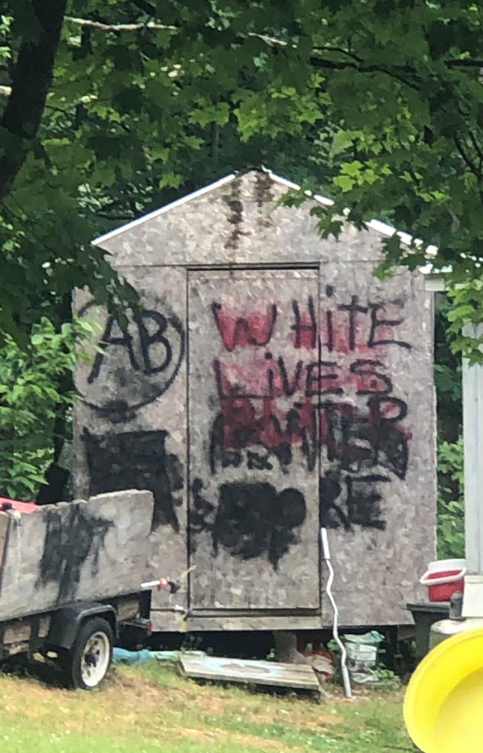 "White Lives Matter More" and AB (Aryan Brotherhood) painting at neighbor's home in southern Vermont.