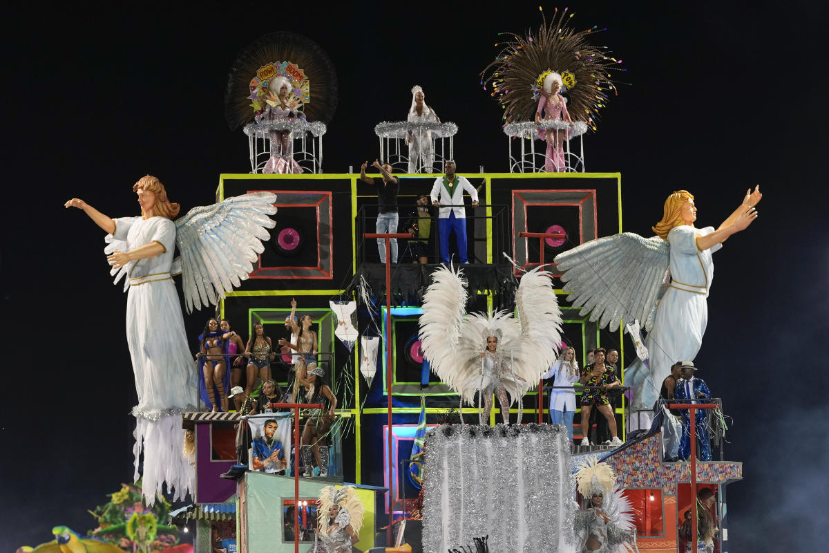 Rio carnival is BACK! Brazil's famous dancers look as flamboyant as ever as  parade returns