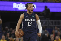 Dallas Mavericks guard Jalen Brunson reacts during the first half of Game 2 of the NBA basketball playoffs Western Conference finals against the Golden State Warriors in San Francisco, Friday, May 20, 2022. (AP Photo/Jed Jacobsohn)