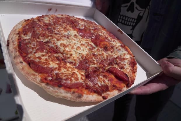 There&#39;s no tip required, and the only human who will touch this pizza is the person eating it.
