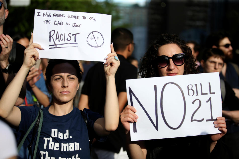 People protest Quebec's new Bill 21, which will ban teachers, police, government lawyers and others in positions of authority from wearing religious symbols such as Muslim head coverings and Sikh turbans, in Montreal, Quebec, Canada, June 17, 2019.  REUTERS/Christinne Muschi