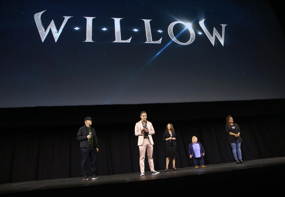 “Willow” executive producers Ron Howard and Jon Kasdan join stars Joanne Whalley and Warwick Davis at Star Wars Celebration alongside Lucasfilm panel host Yvette Nicole Brown. - Credit: Jesse Grant/Getty Images for Disney